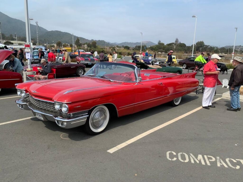 Al Murolo’s 1960 Cadillac convertible is 19 feet long, so phooey on the compact parking spaces.