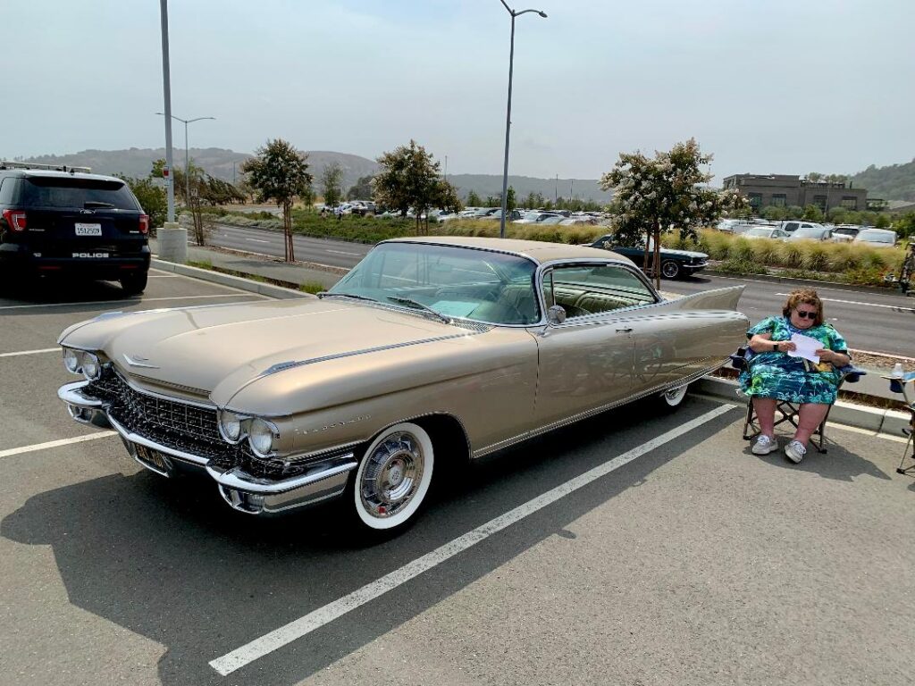 4 David & Darcy Greenburg’s 1960 Eldorado Seville. Darcy wisely brought along a mystery novel.